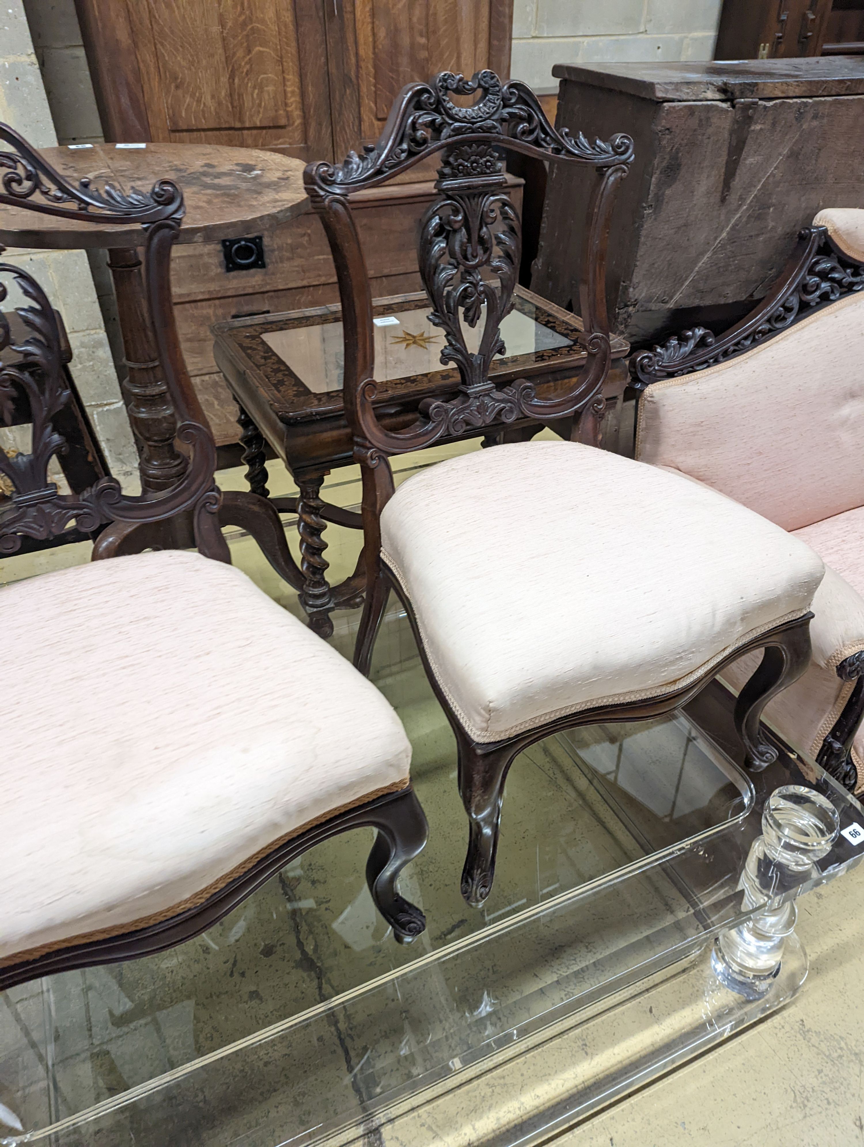 A late Victorian carved mahogany seven piece salon suite, settee length 140cm, depth 60cm, height 94cm